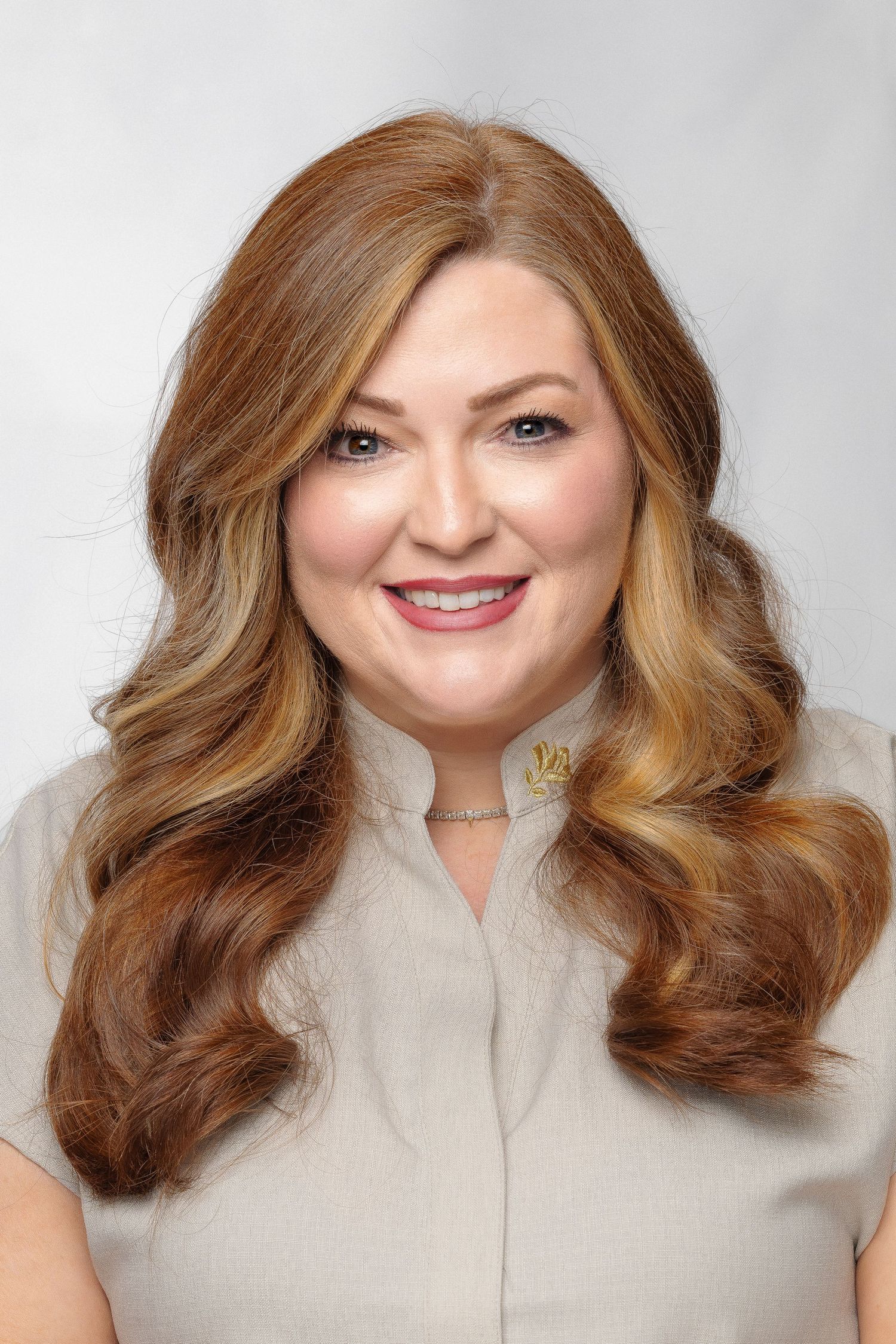 Professional studio portrait series showing warm honey-colored wavy hair styled in voluminous shoulder-length curls.