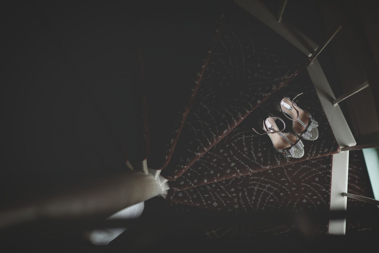Artistic overhead view of wedding dress details and accessories.