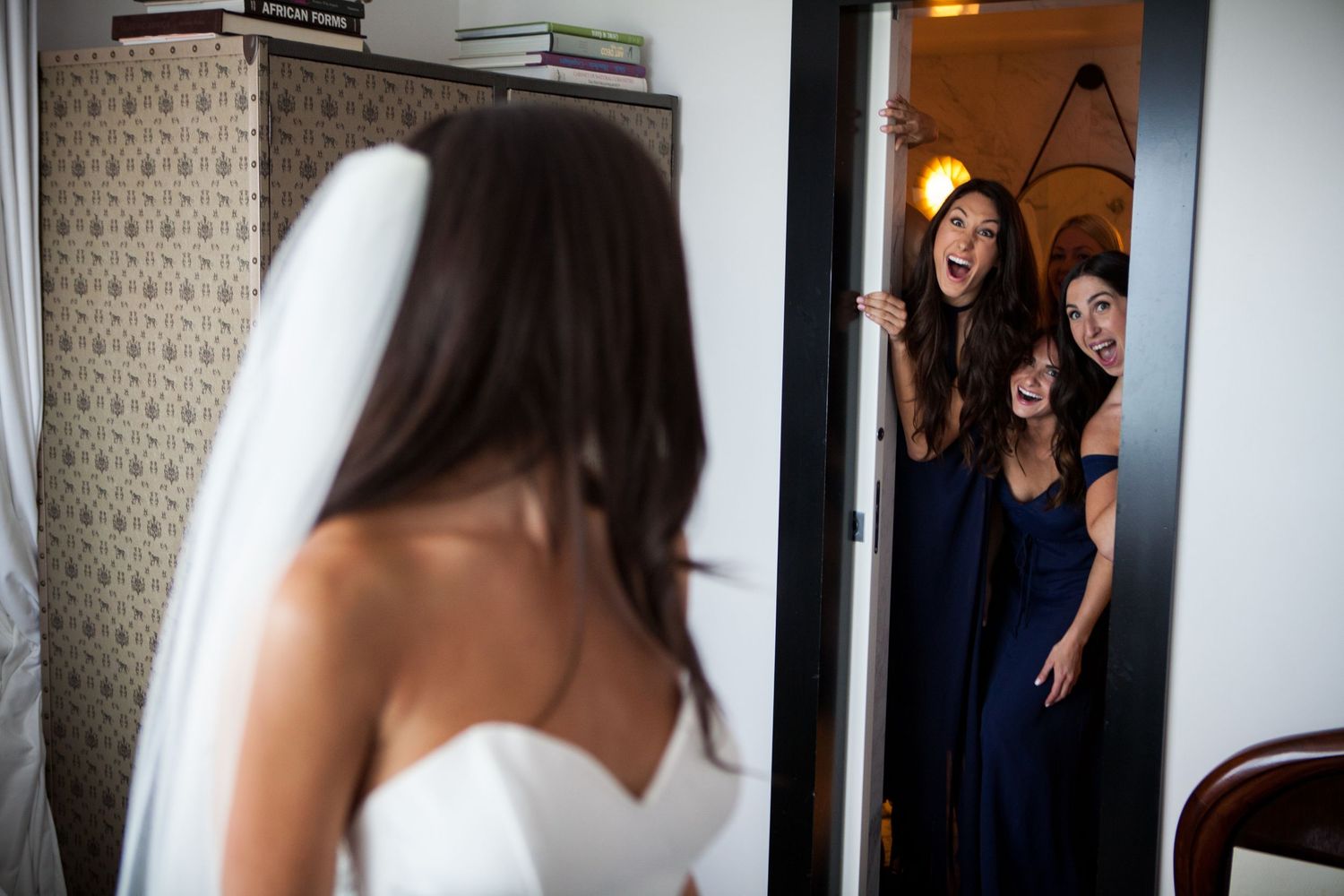 Behind-the-scenes sequence of getting ready moments in a bright hallway.