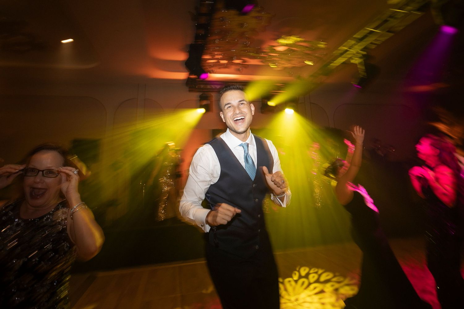 Group of people dancing at a nightclub with colorful lights and energetic atmosphere visible across multiple frames.