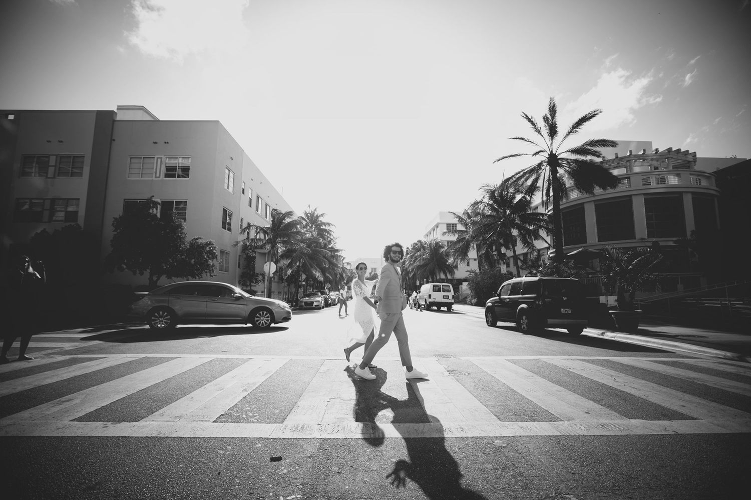 Artistic black and white street photography capturing shadowy urban scenes.