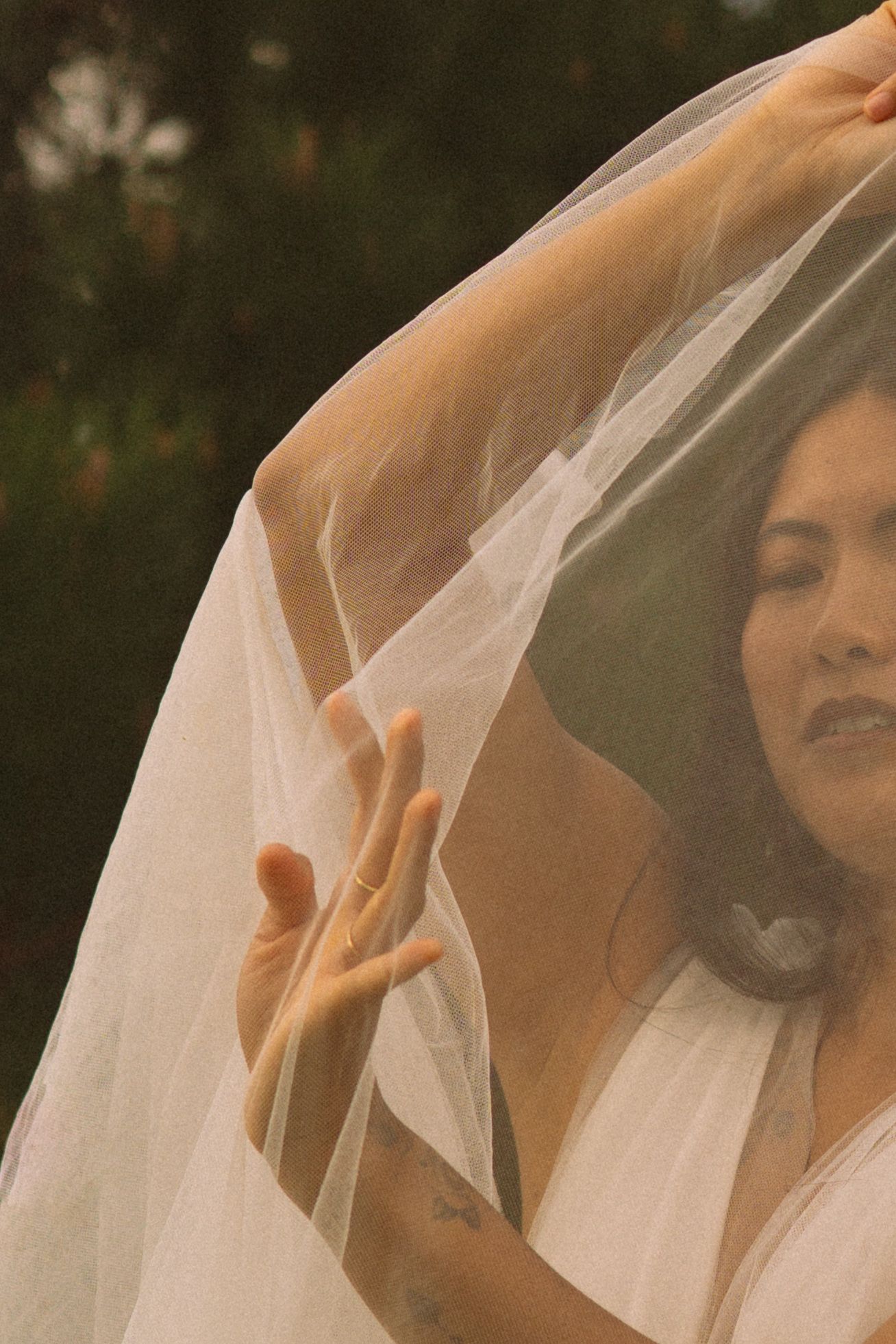 Ethereal portrait sequence showing movement of white veil in warm sunlight.