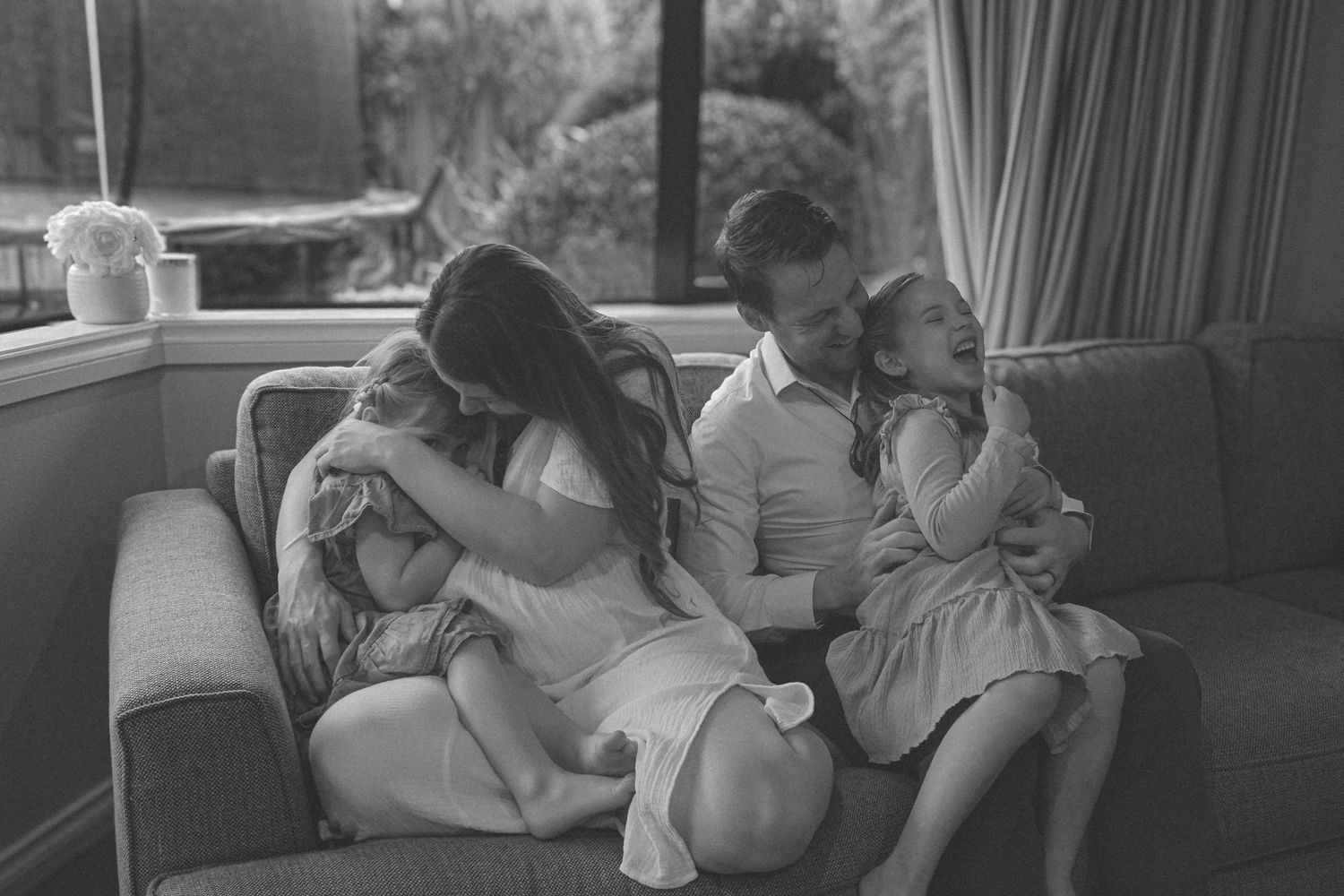Indoor lifestyle photos showing quiet bonding moments between family members.