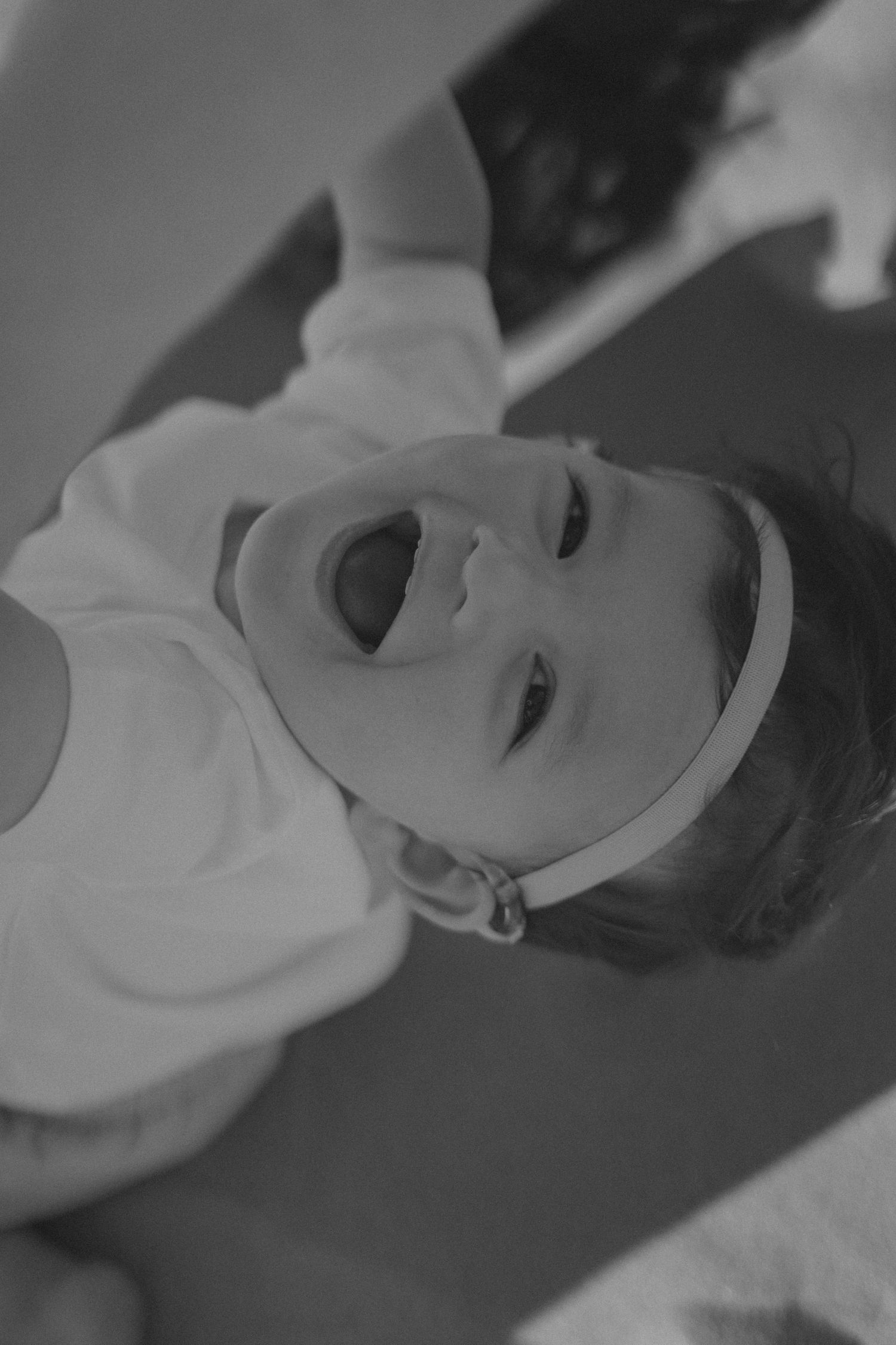 A sequence of black and white close-up shots showing a medical procedure being performed with surgical tools.