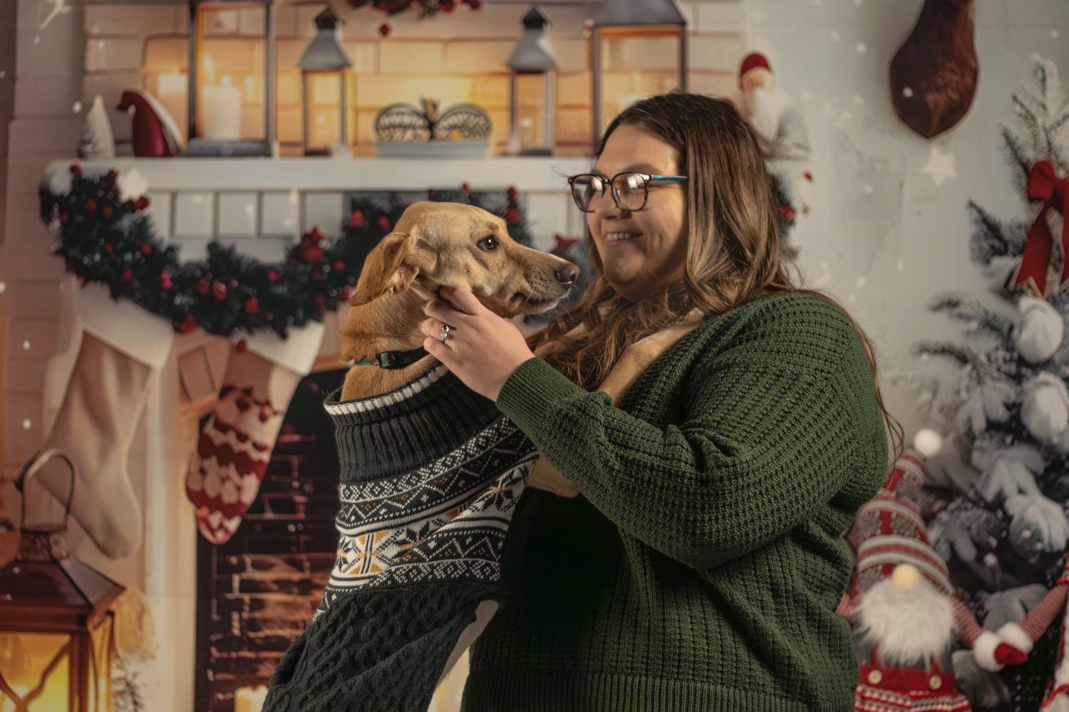 People enjoying holiday festivities and decorating with Christmas ornaments in a cozy indoor setting. Pet and dog photography in Burlington