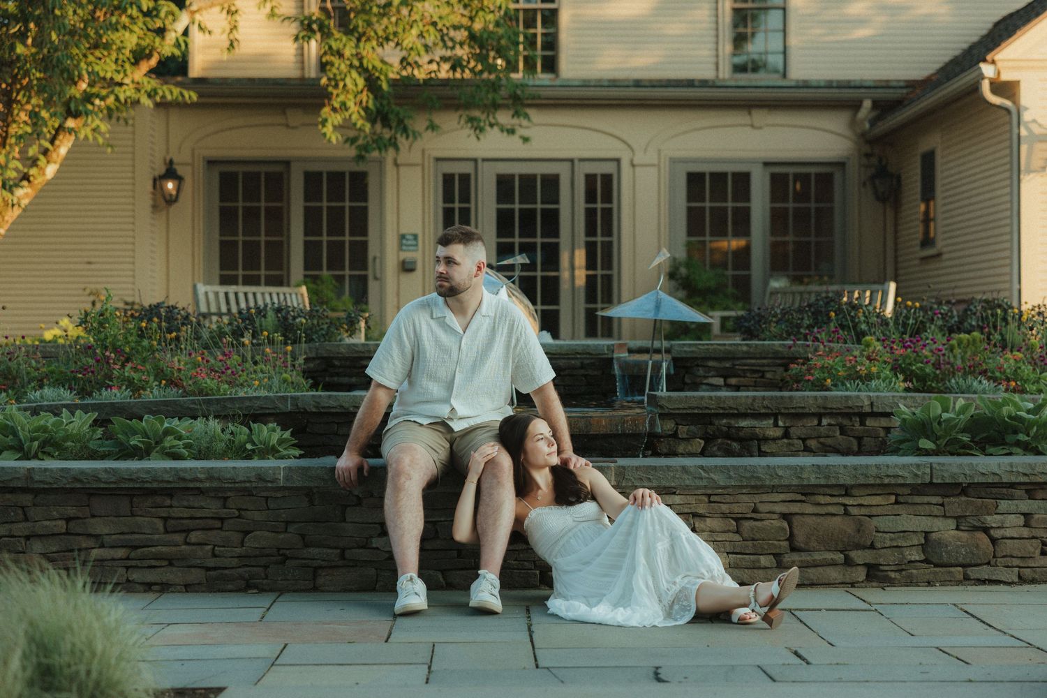 A series of six connected outdoor patio scenes showing stone walls, furniture, and landscaping at a residential property.