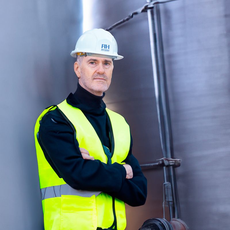 Professional commercial photographer in full PPE on a construction site in Kent