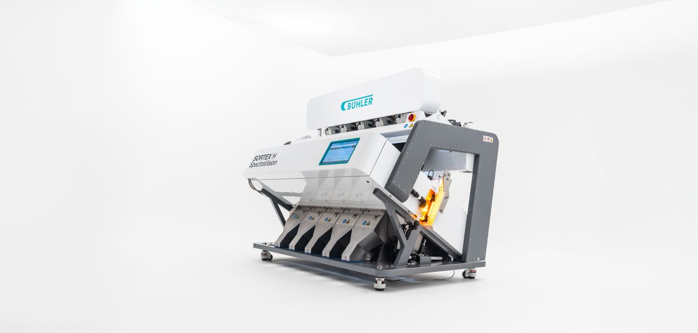 Modern industrial color sorting machine with sleek white and gray design for automated material processing.