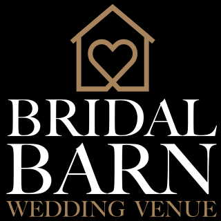 Bridal Barn Wedding Venue logo featuring a gold barn outline with a heart design on a black background.