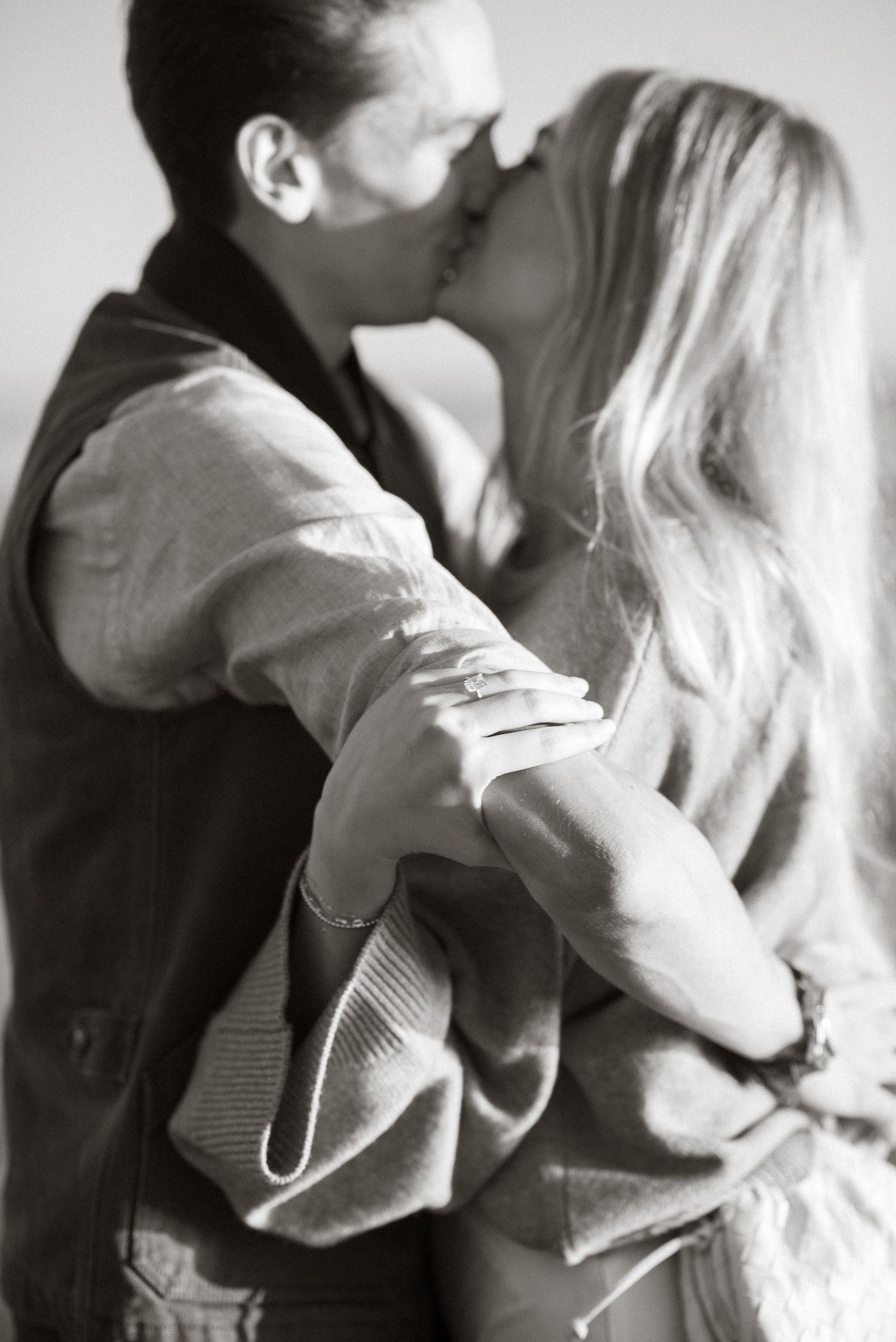 An intimate black and white portrait series capturing romantic moments between a couple.