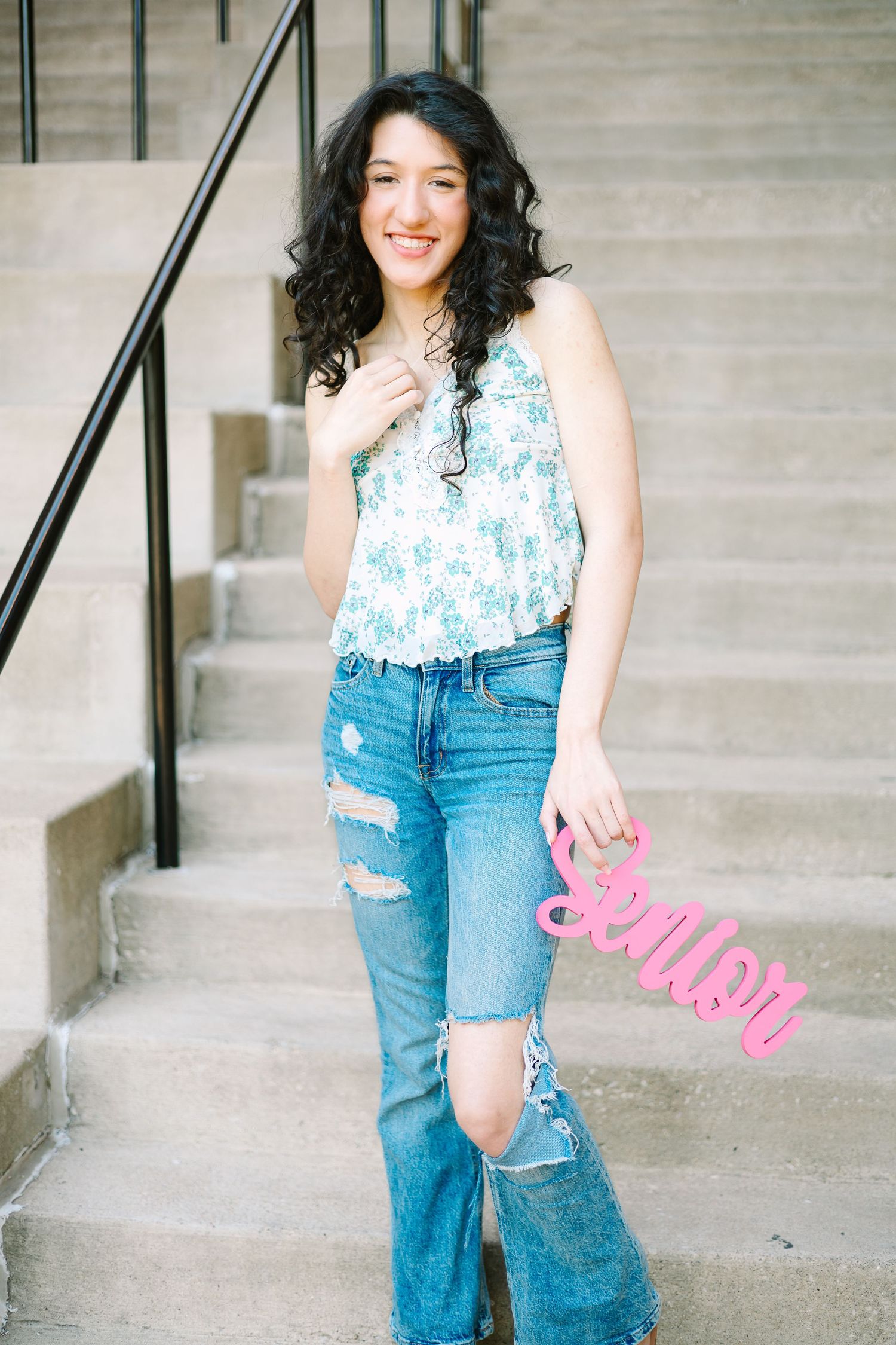 Young woman in floral top and distressed jeans poses playfully on concrete steps in a multi-image collage.