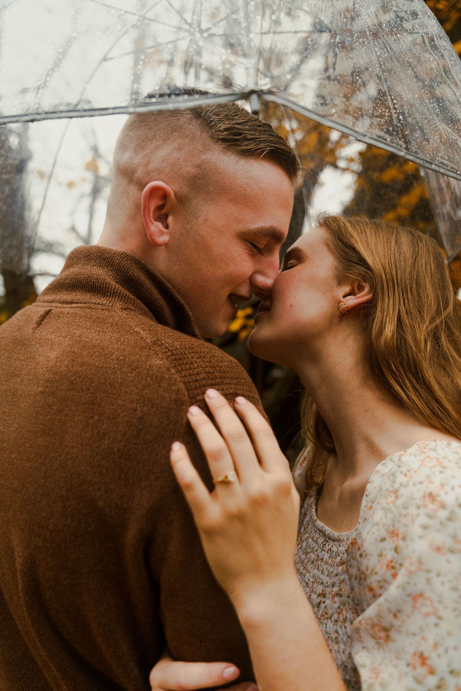 Close-up romantic moments captured against a soft winter backdrop.