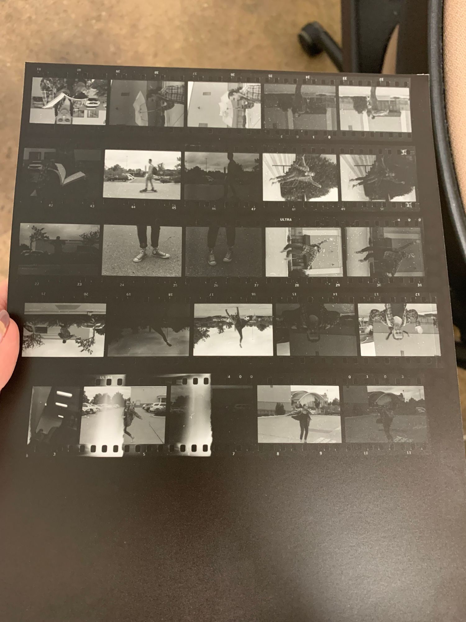 A collage of black and white photographic images, including various scenes and objects.