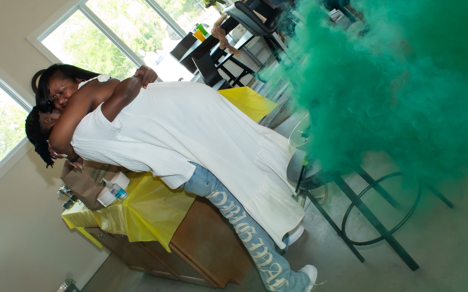Students in a classroom work with green powder during a colorful science experiment.
