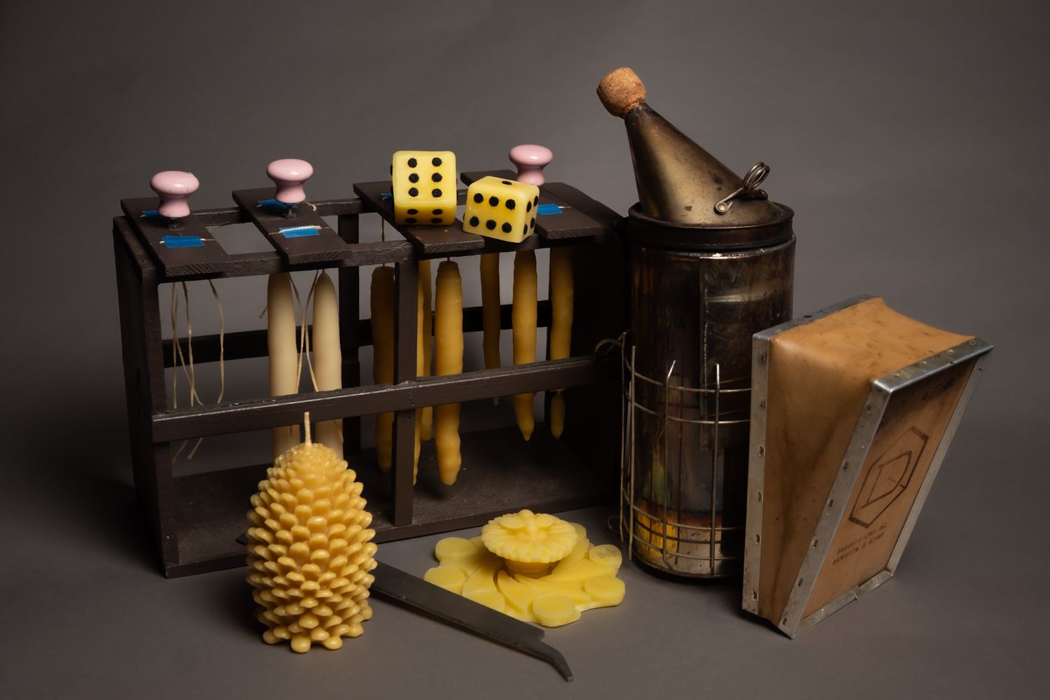 Collection of wooden boxes and decorative items arranged on dark surface with dramatic lighting.