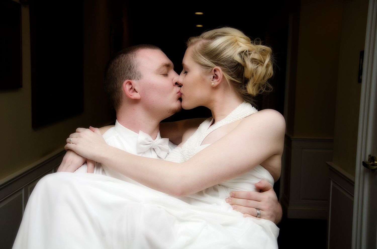 a couple kissing at the wedding reception