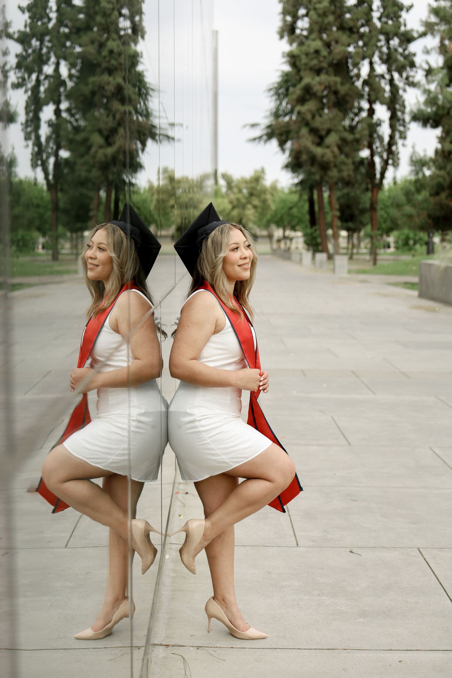 A series of artistic poses showing someone in a white dress and red jacket against an outdoor backdrop.