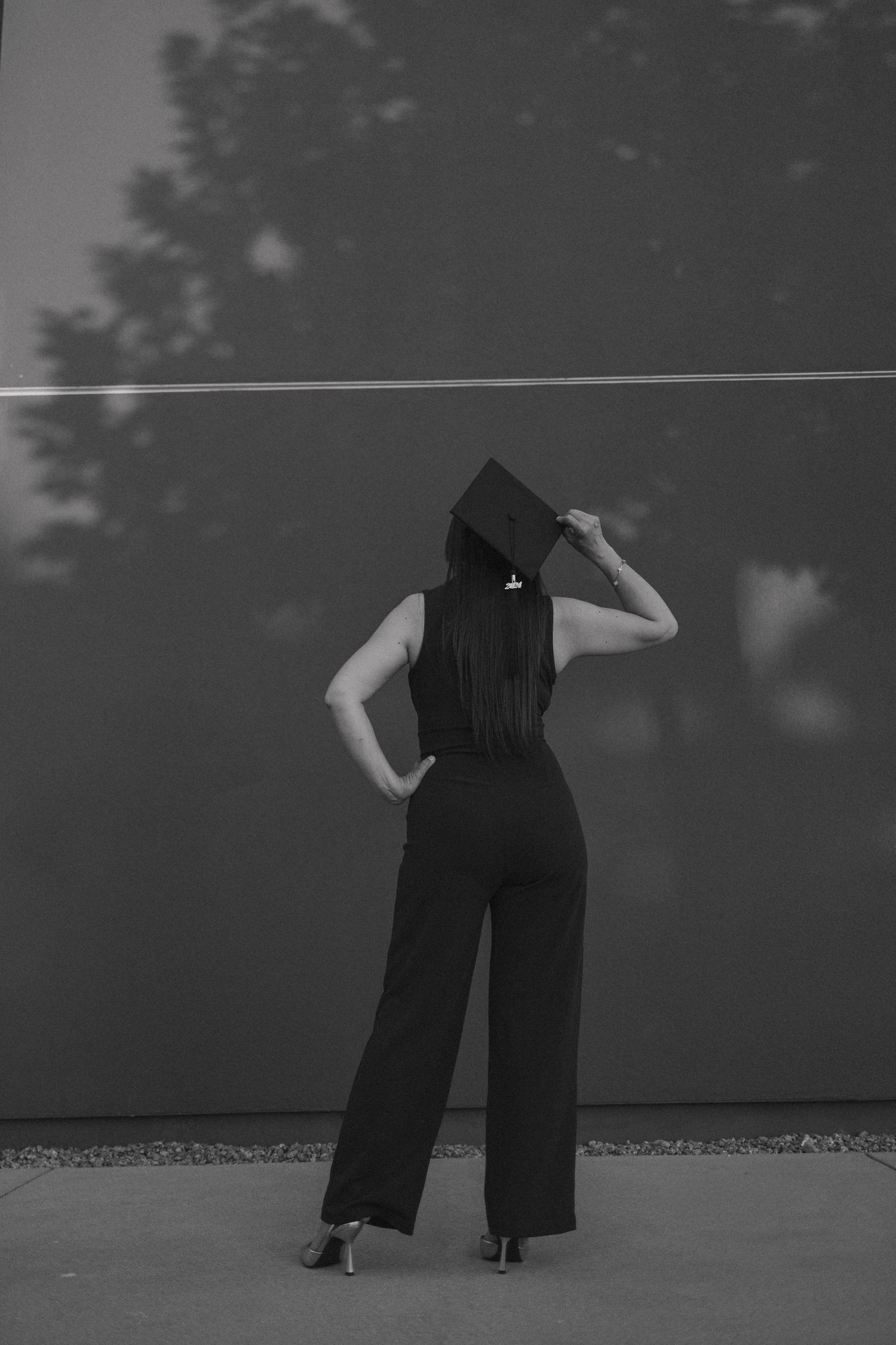 A black and white photo series shows a person in dark clothing performing dance-like movements against a misty backdrop.