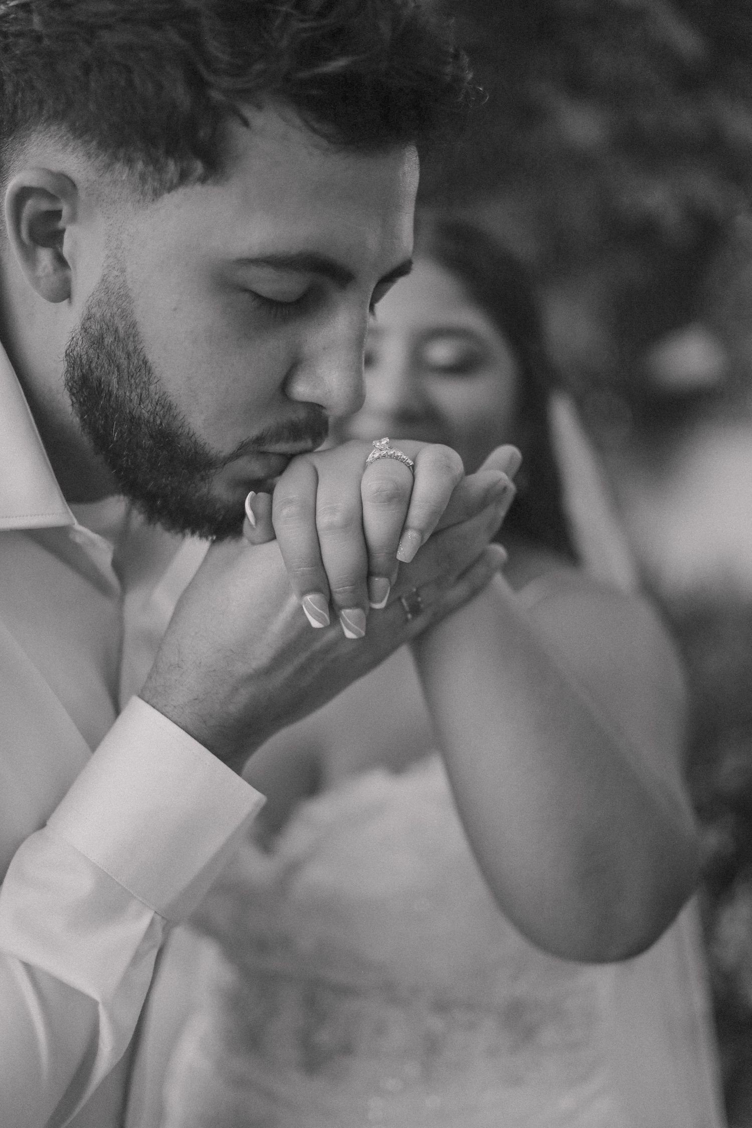 Black and white emotional wedding portraits showing tender moments between newlyweds.