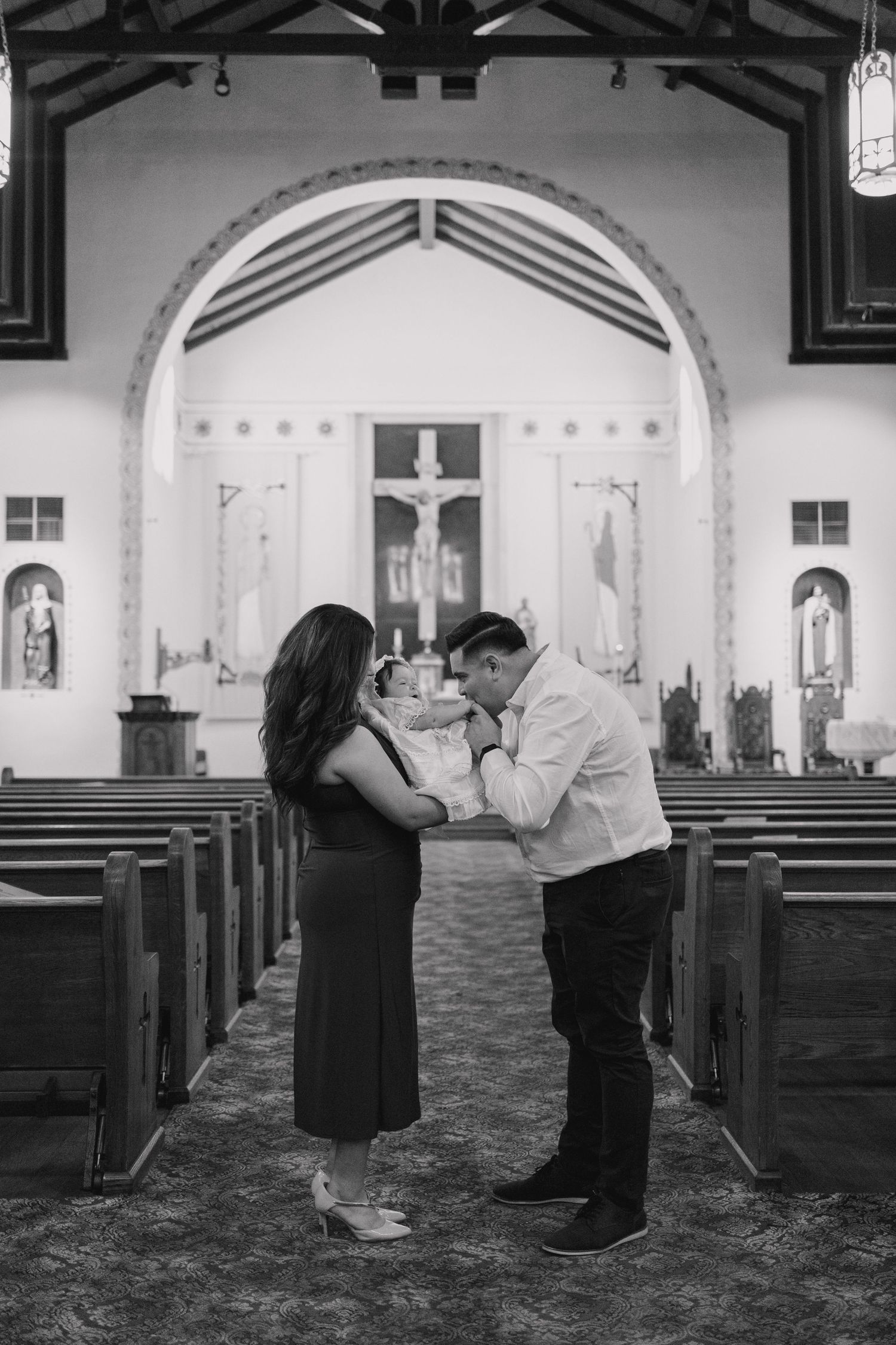 A sequence of black and white photos showing a couple dancing together in an empty church sanctuary.