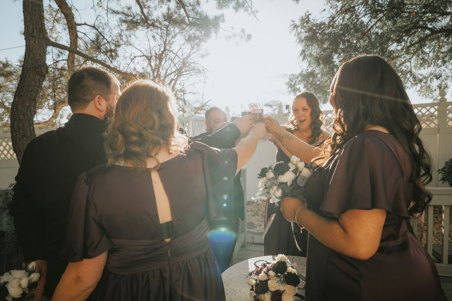 Wedding guests mingling during golden hour at an outdoor celebration at La Grande Estates