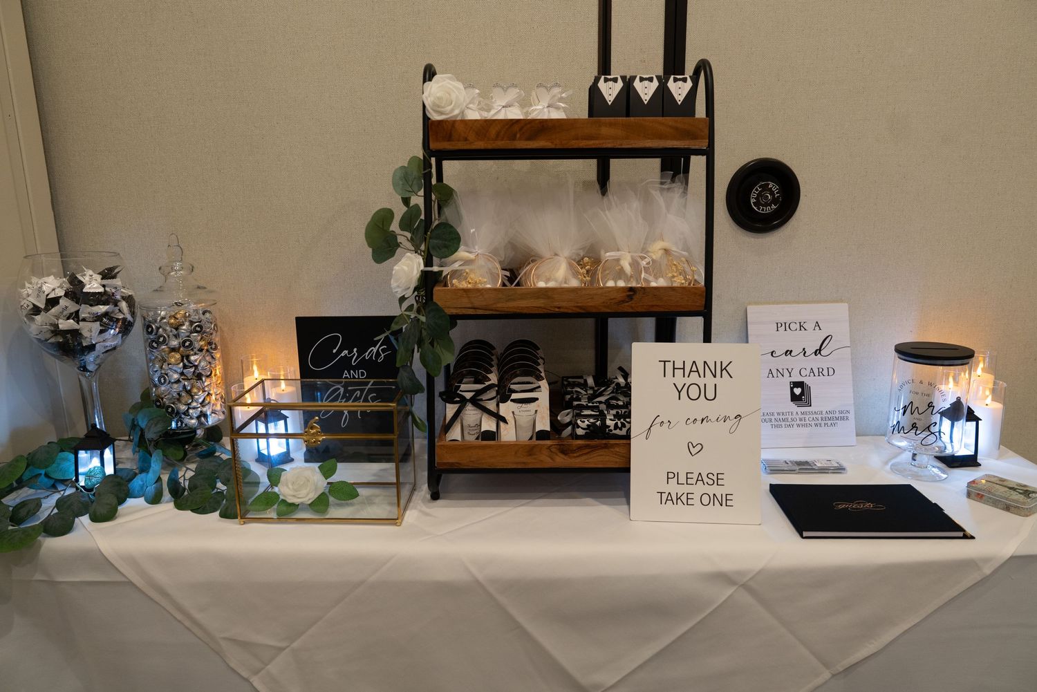 Wedding reception table with decorative place settings and gift table displays at Forest Suits Resorts