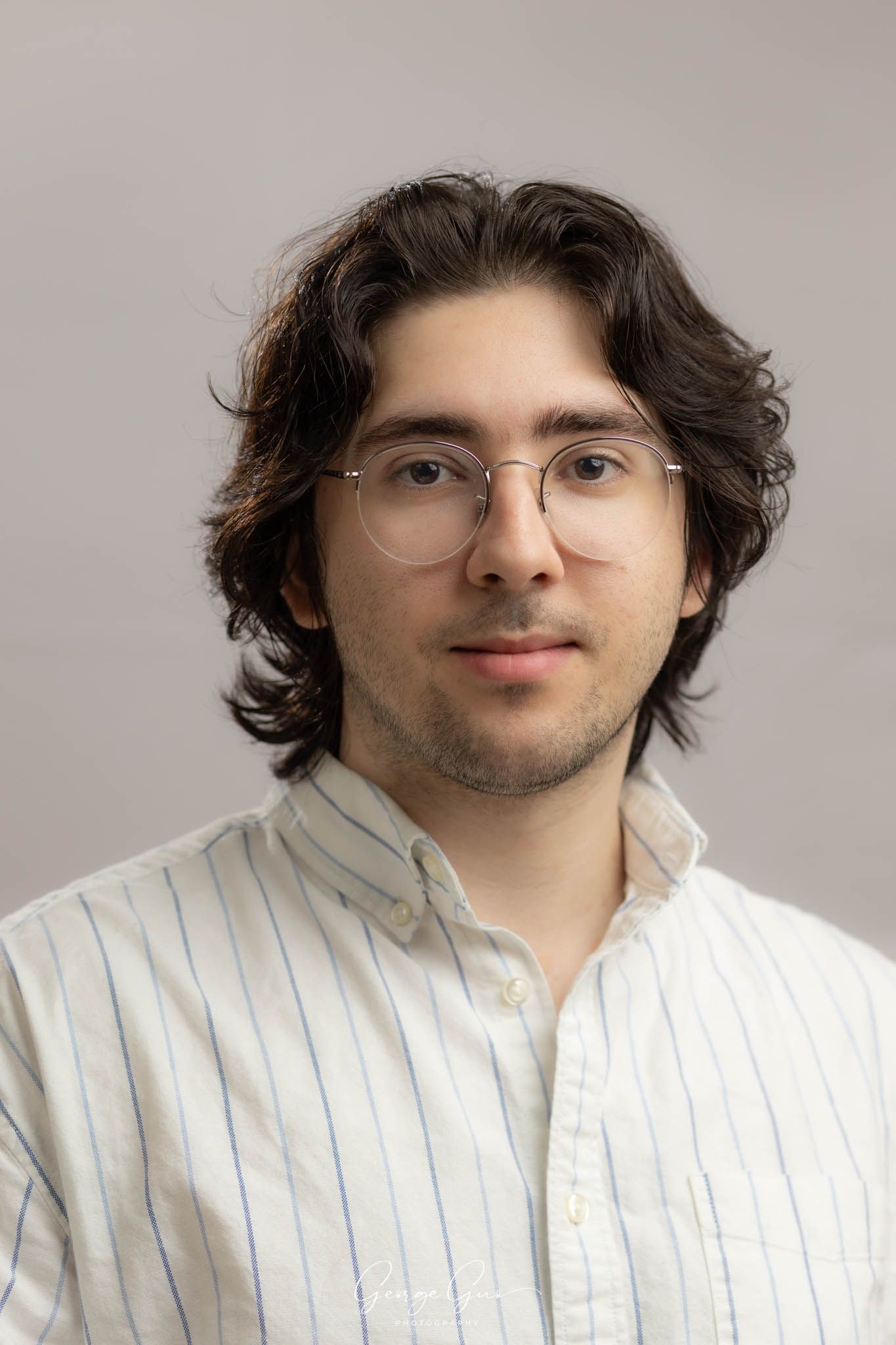 Professional headshot of a man wearing a shirt, captured in a studio lighting setup by George Guo Photographer