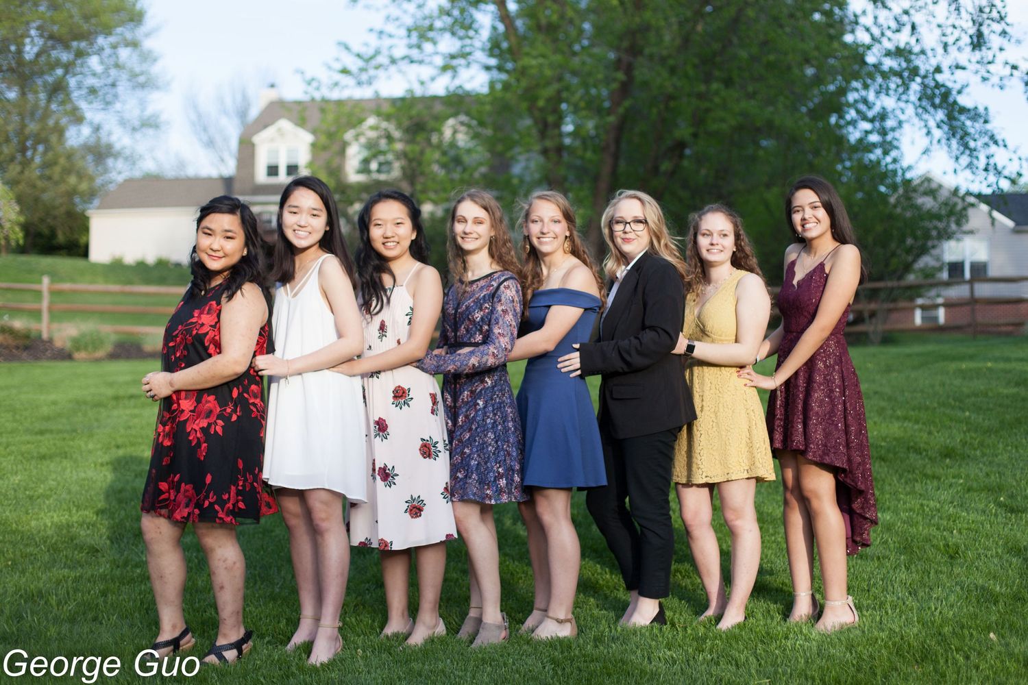 A group of young women standing in a line and posing at a party celebration, captured by George Guo Photographer