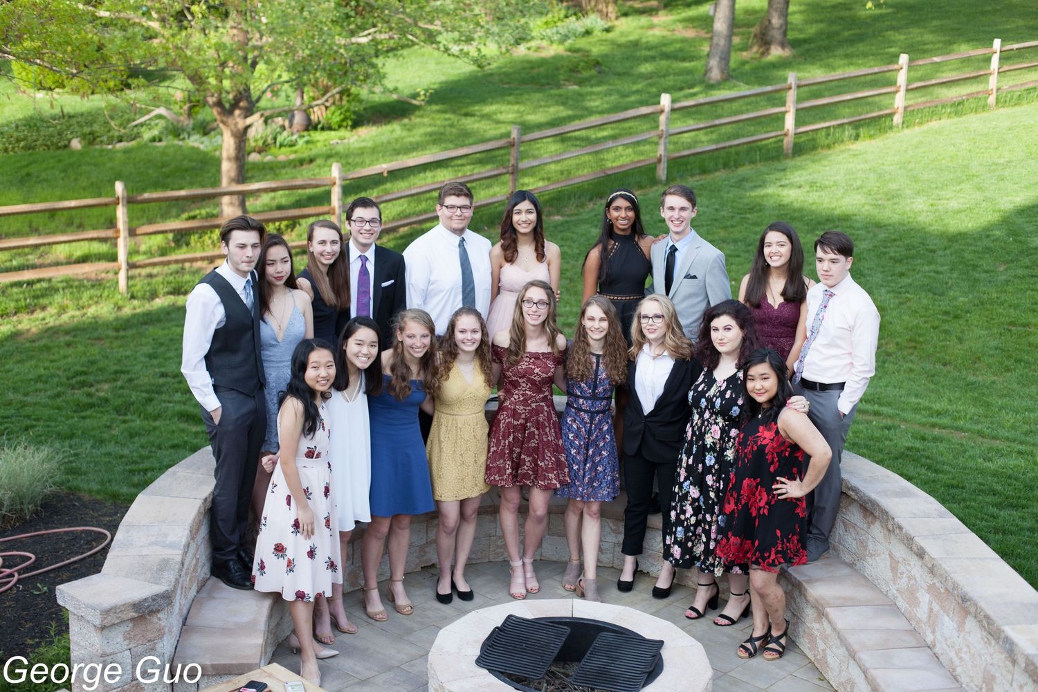 A group of young men and women standing in a half-circle at a party celebration, captured by George Guo Photographer