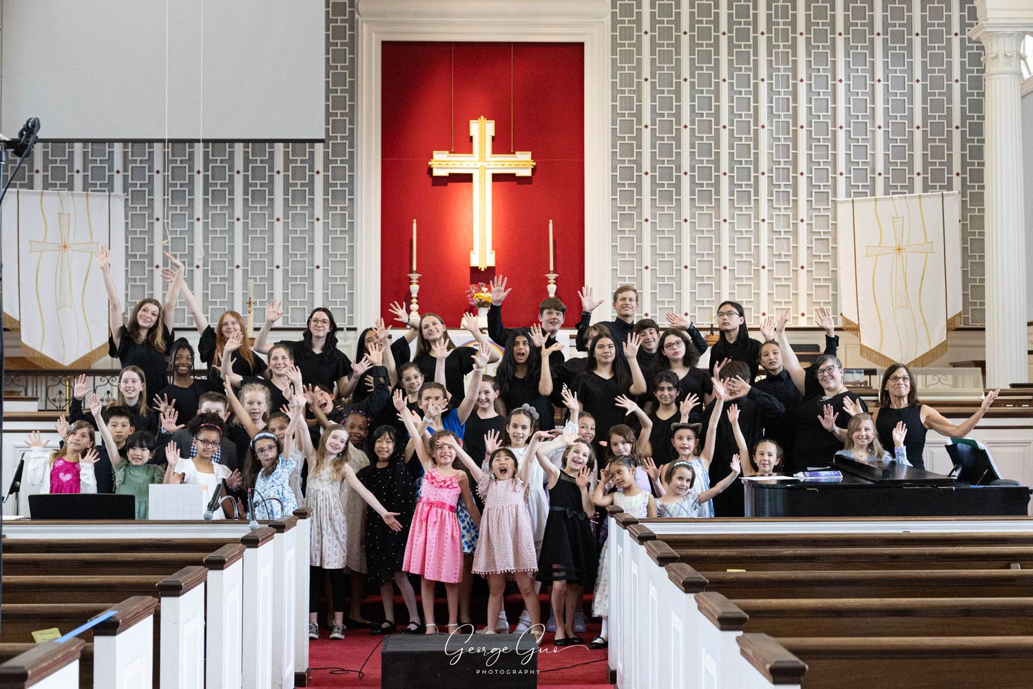 A group of children posing together before performing on stage at a church concert, photographed by George Guo Photographer