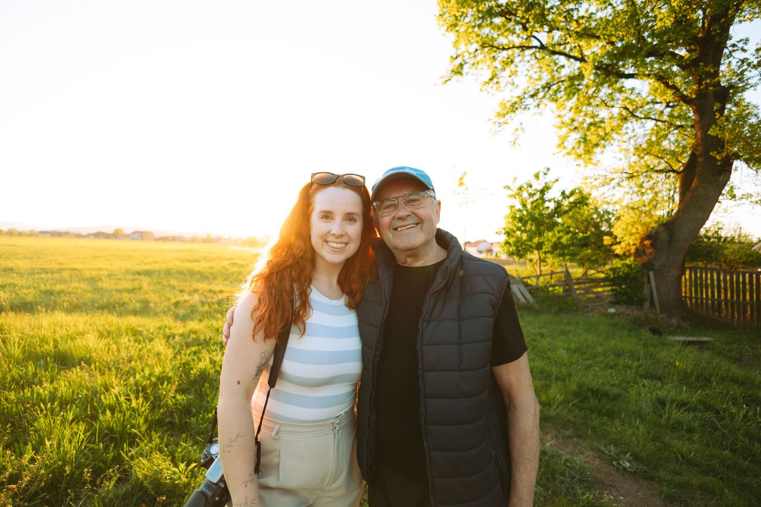 granddaughter and grandfather together during sunset
