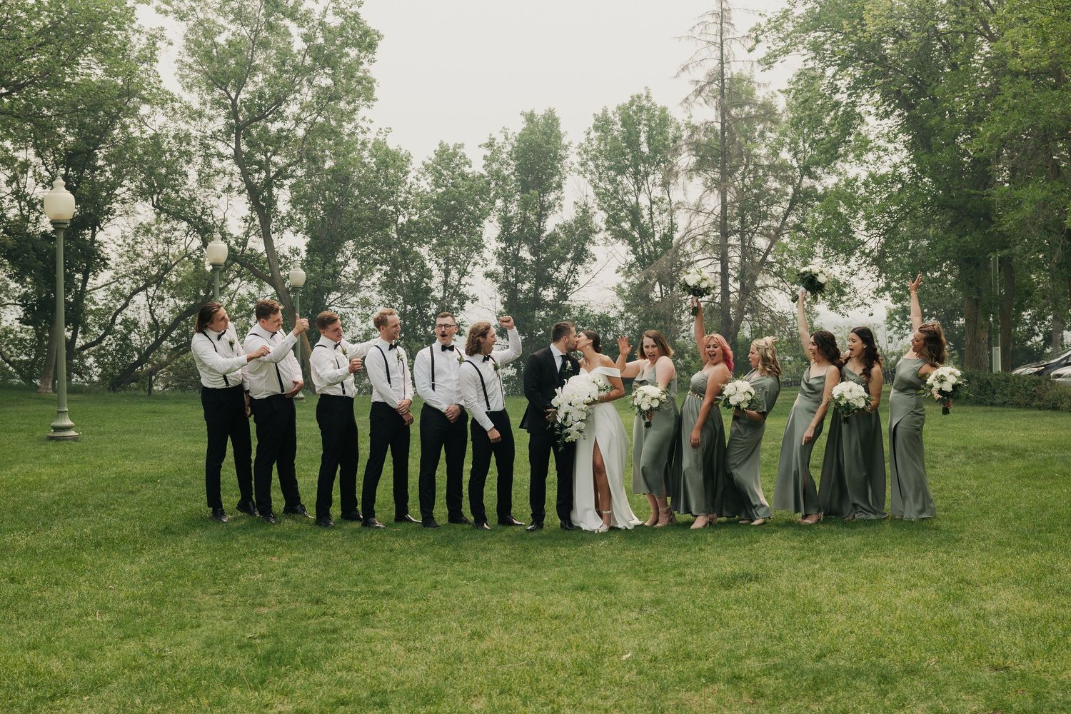 Wedding party group photo in Alberta captured while having fun