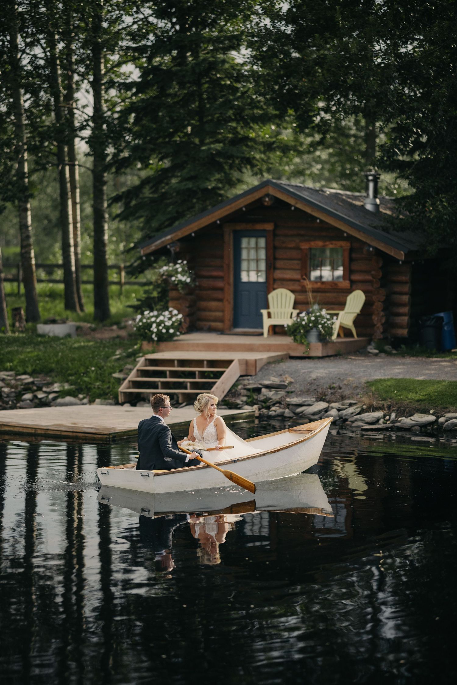 couple on boat at pine and pond wedding venue
