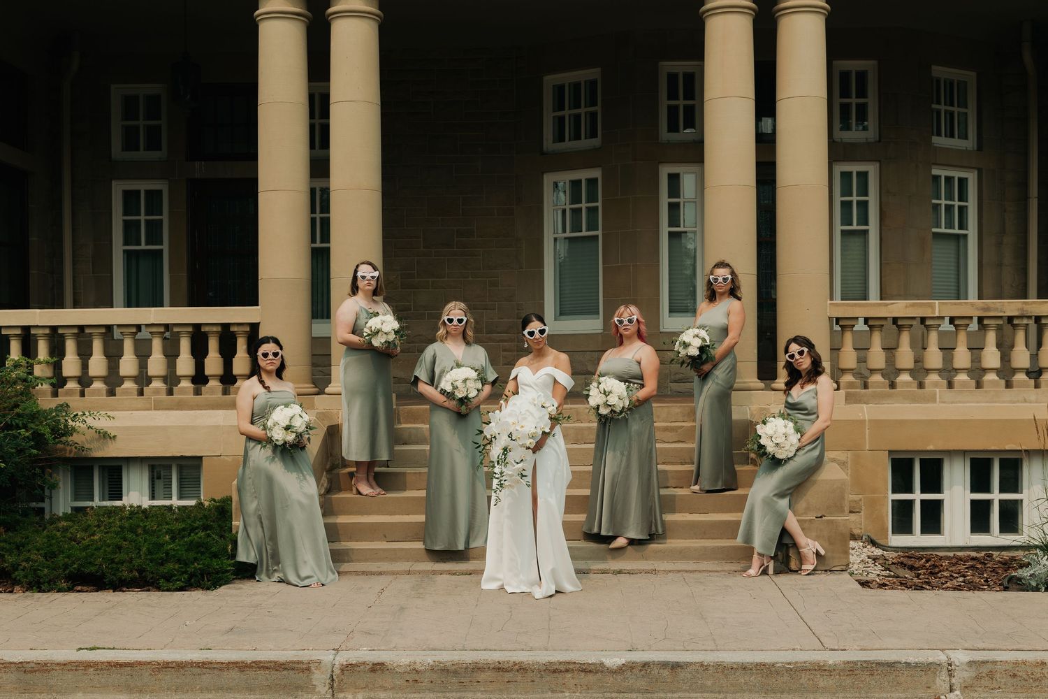 Wedding party group photo in Alberta captured with a natural and relaxed approach.