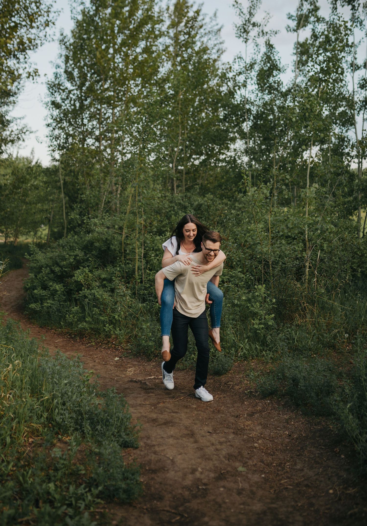 piggyback ride during engagement session