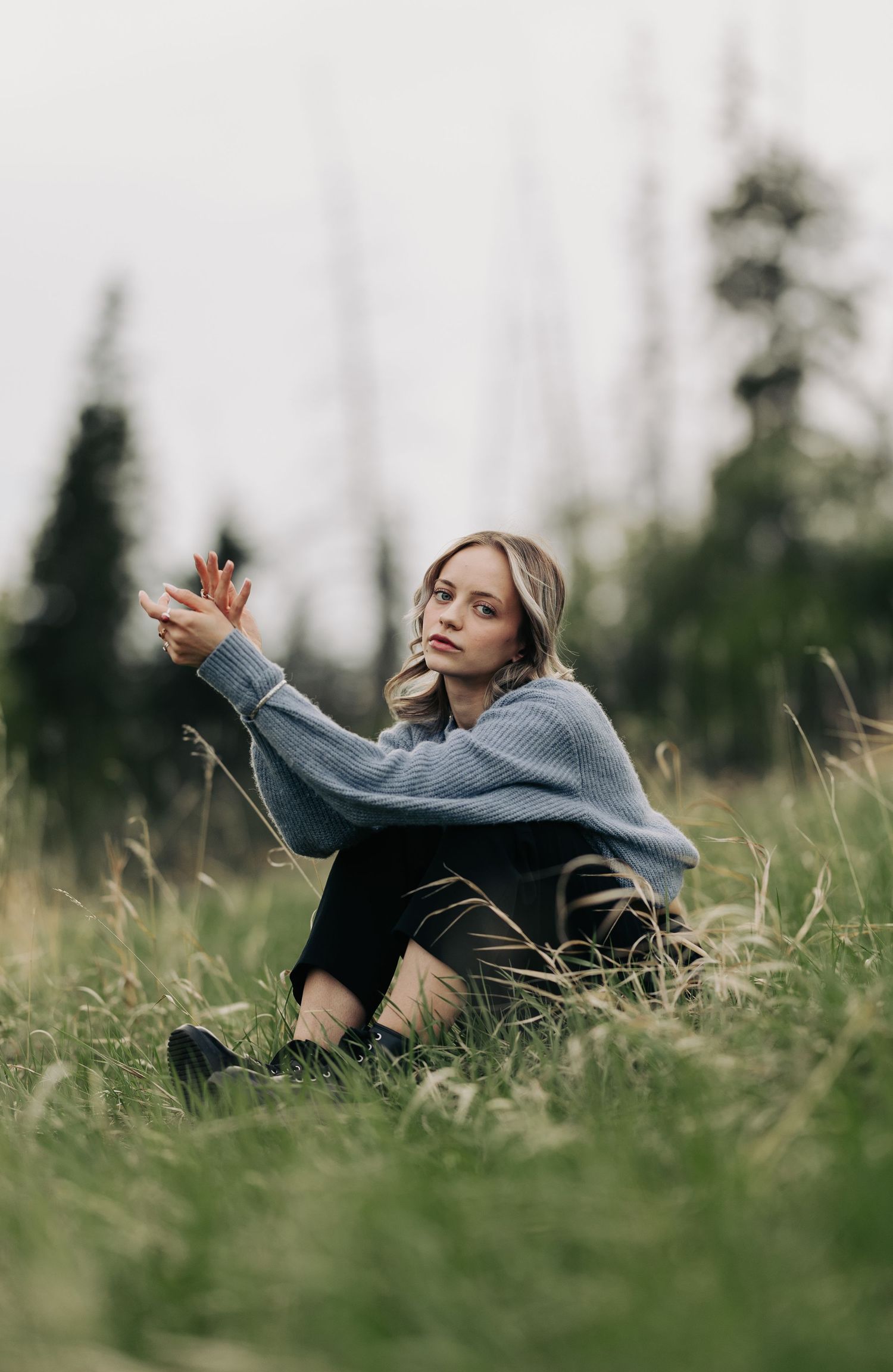 Edmonton model posing in the grass in Edmonton by Marcu Fotography
