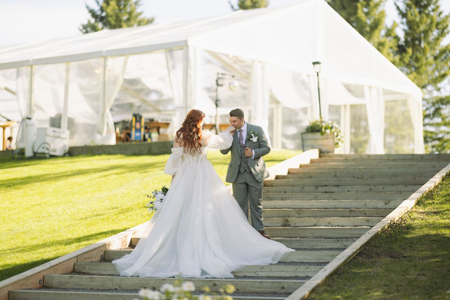 couple on wedding day on staircase at pine and pond