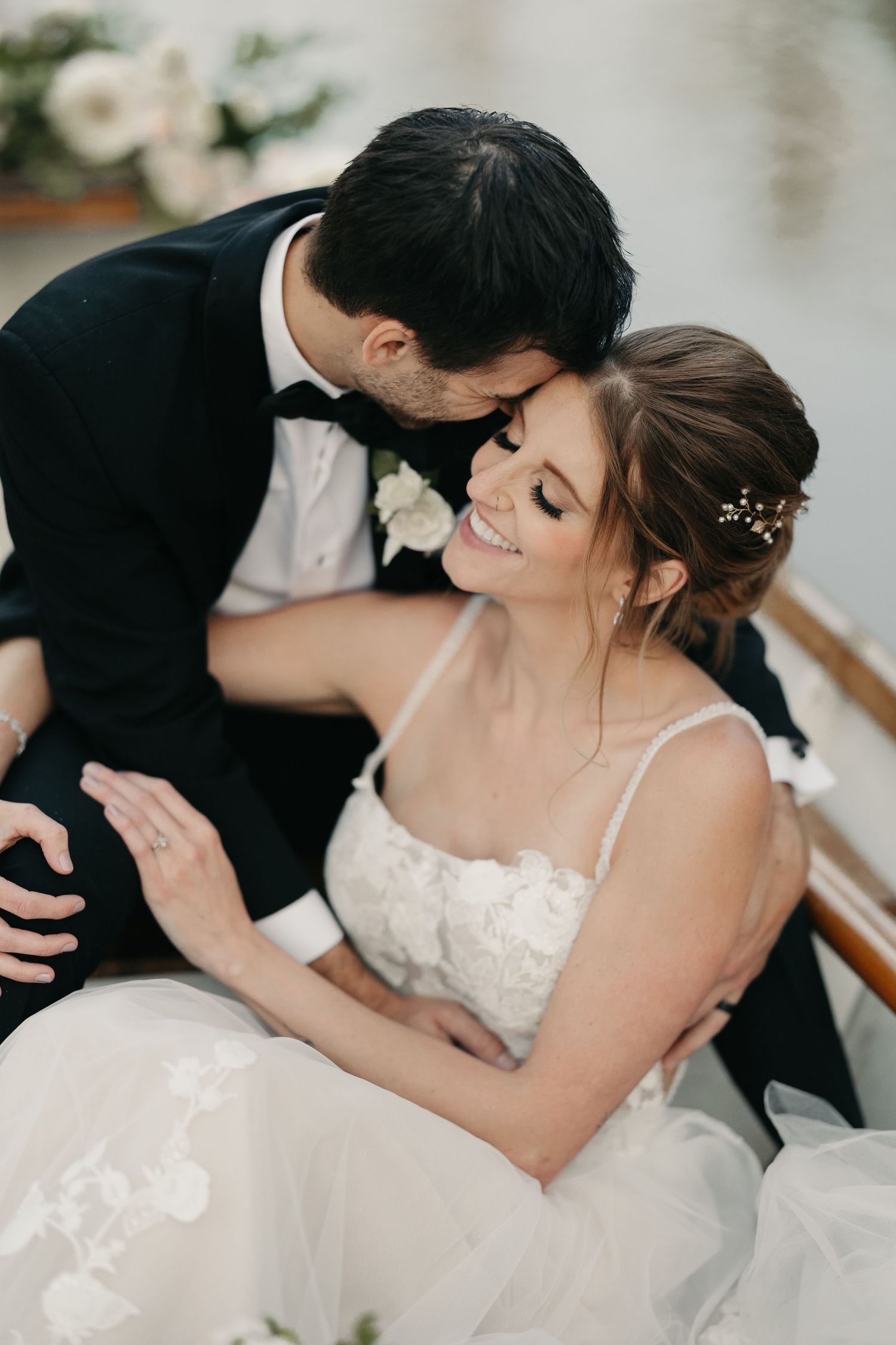 bride and groom in wedding boat
