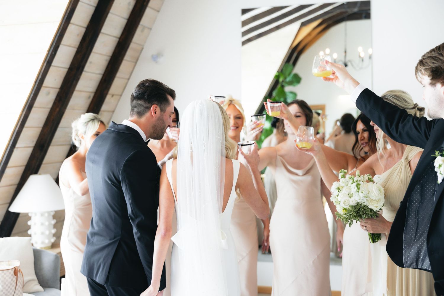 luxury wedding photography capturing cheers of bridal party by Marcu Fotography