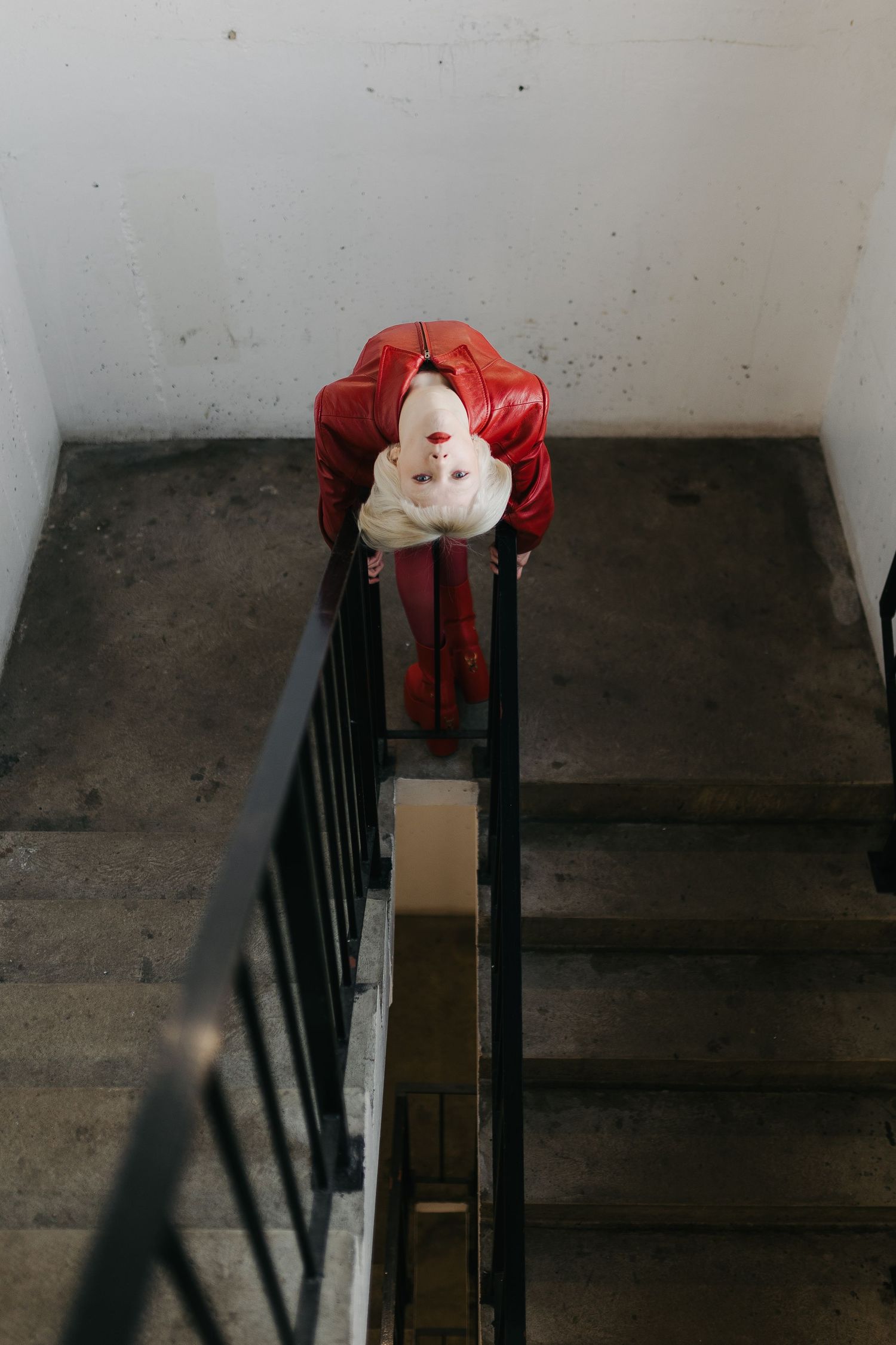 edmonton stairwell capturing editorial model in red captured by Marcu Fotography