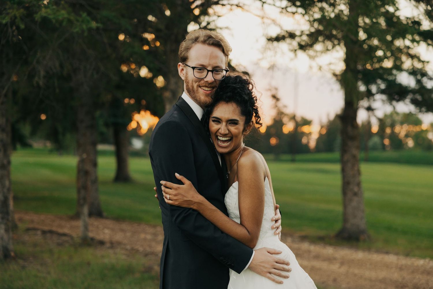 cute moment between bride and groom during sunset