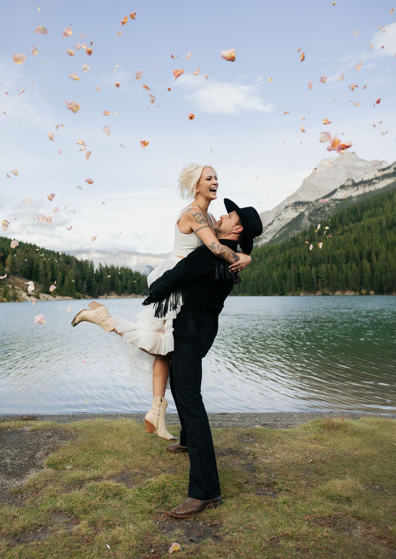 Banff wedding photography capturing candid moment of couple with flowers