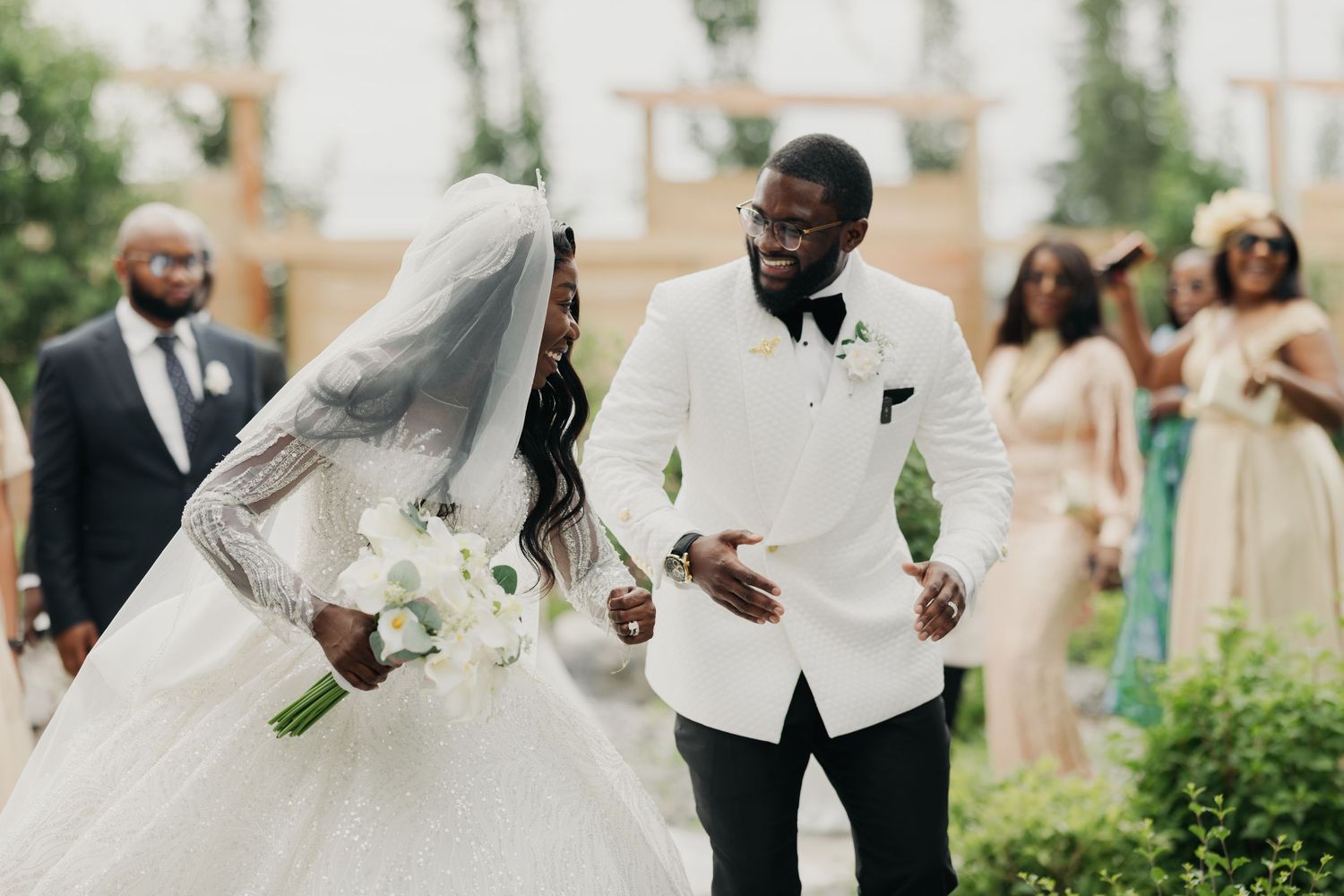 Nigerian couple exiting the ceremony while dancing