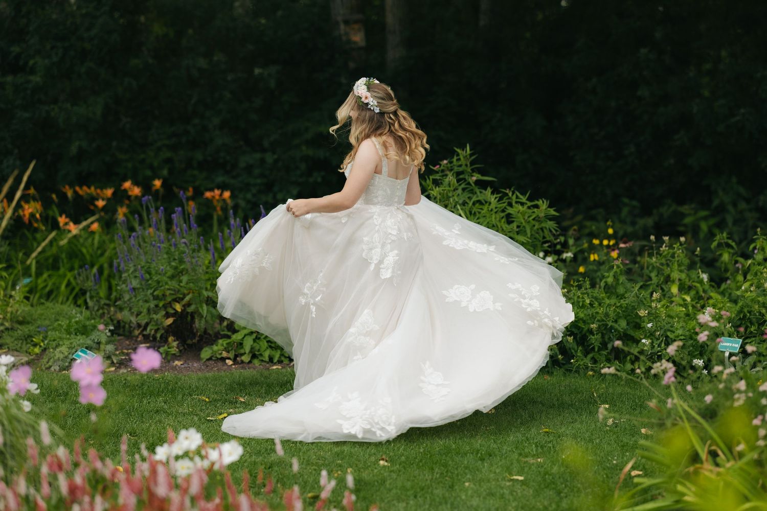 bride twirling on her wedding day