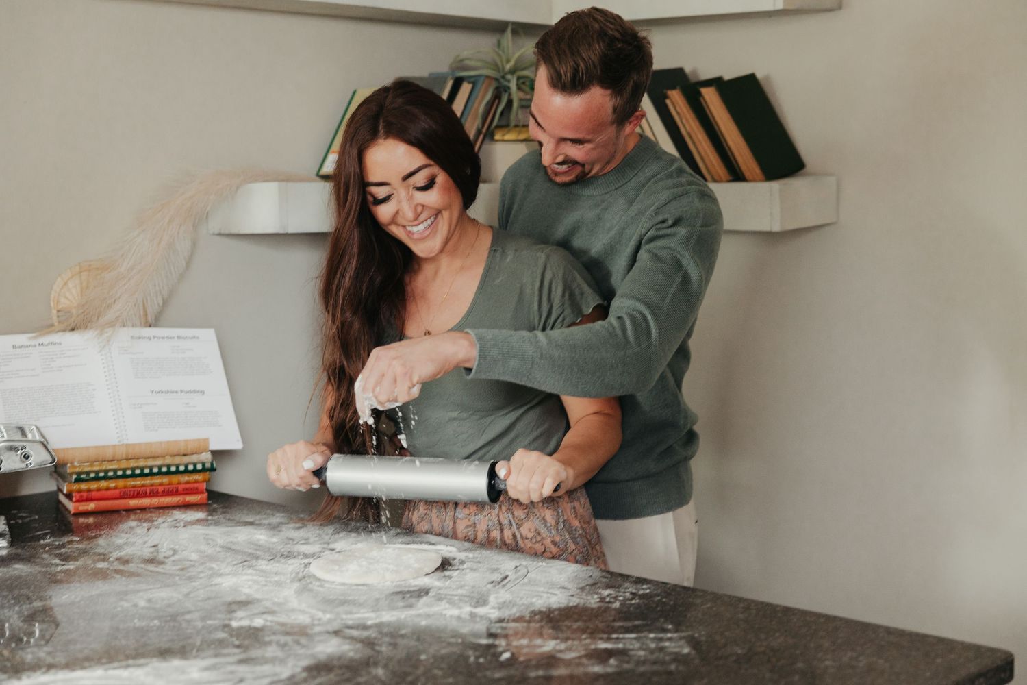 in home couple photoshoot making pizza