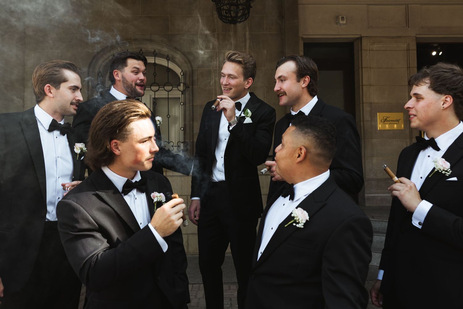 fairmont groomsmen smoking cigars