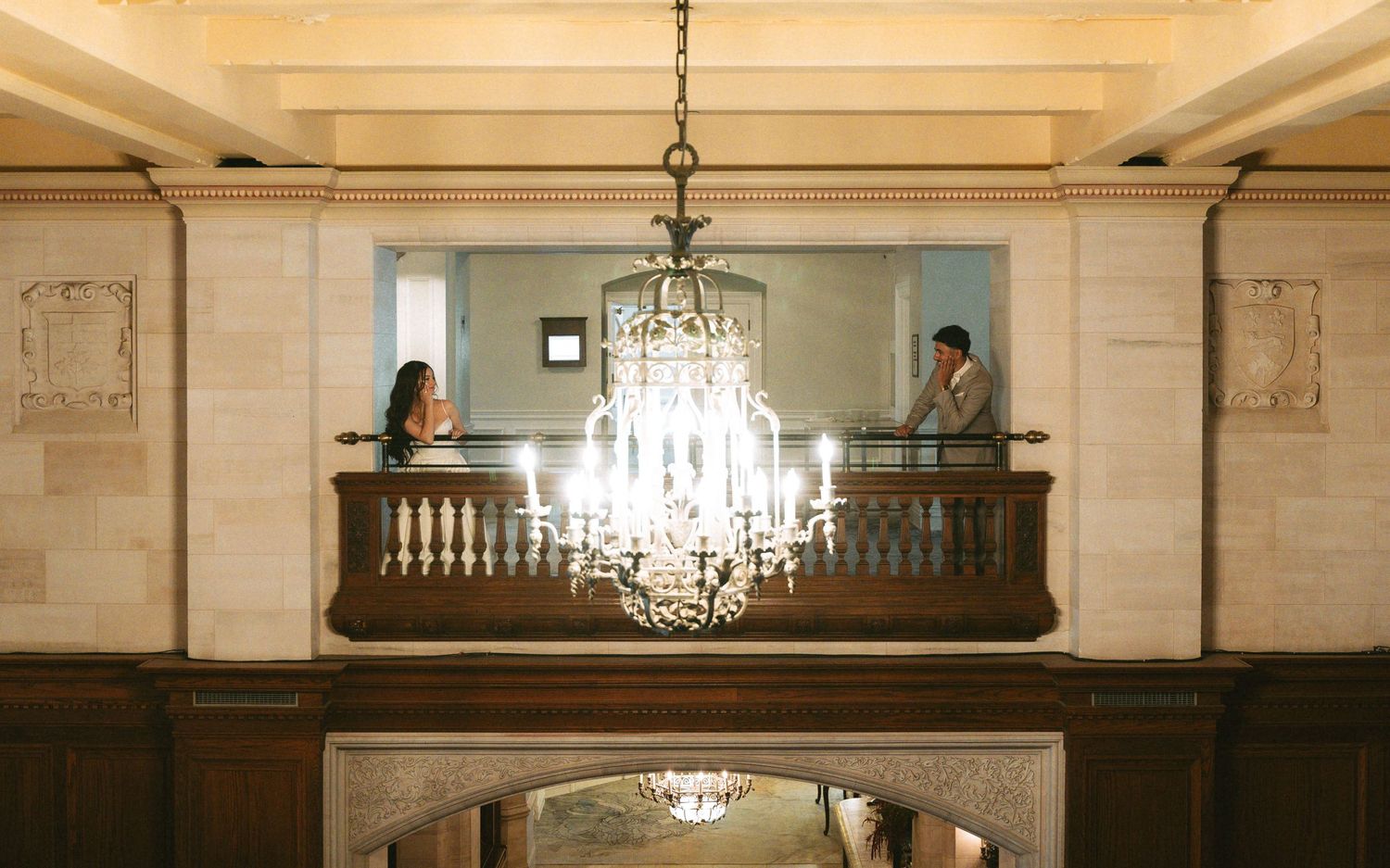Fairmont photoshoot with couple and chandelier in between