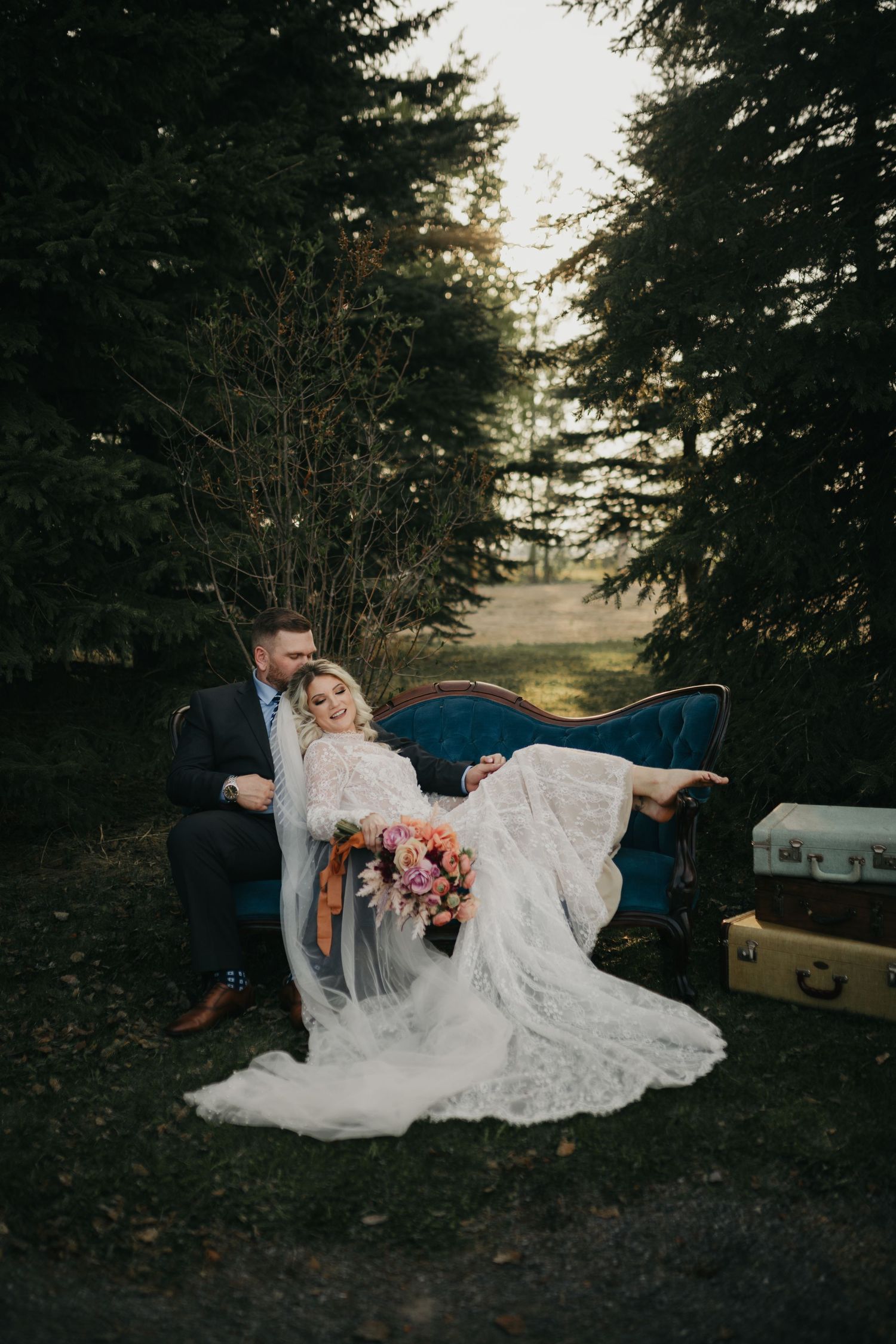 wedding couple sitting on vintage chair during portraits