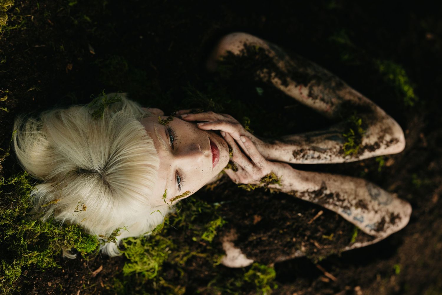 women covered in dirt modelling for editorial photoshoot