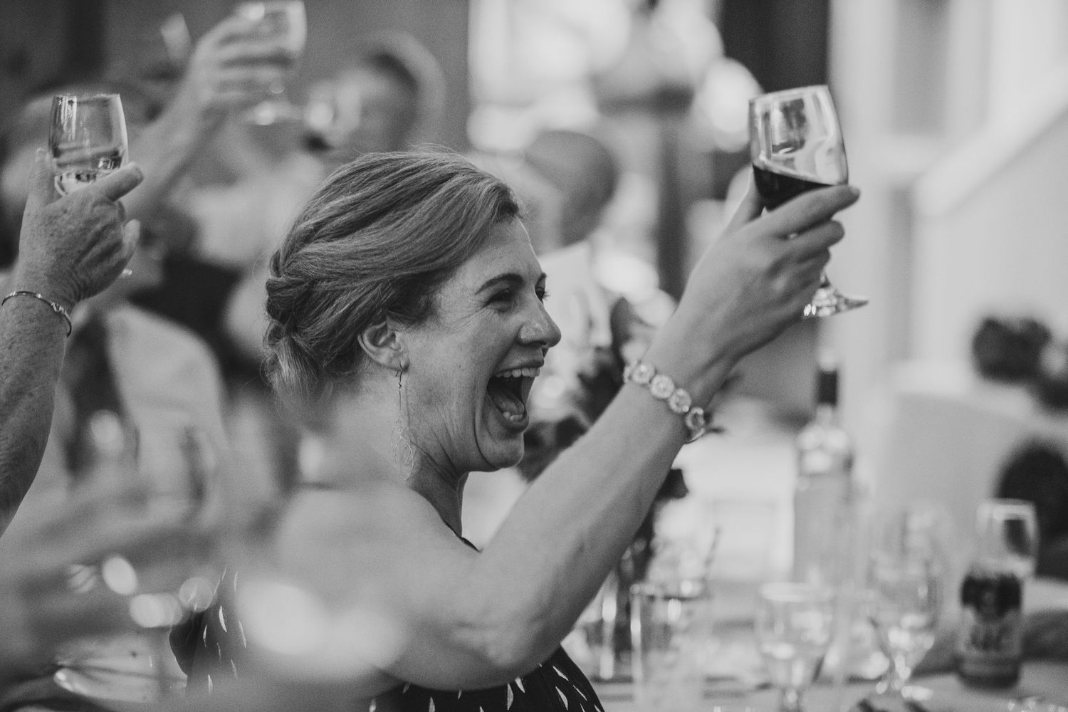 Edmonton wedding photographer documenting candid reception moments and guest interactions.